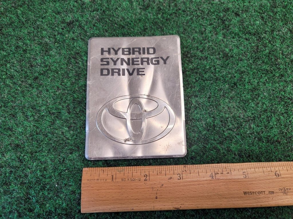 2004-2009 TOYOTA PRIUS HYBRID SYNERGY DRIVE DC CONVERTER EMBLEM BADGE OEM 2M3
