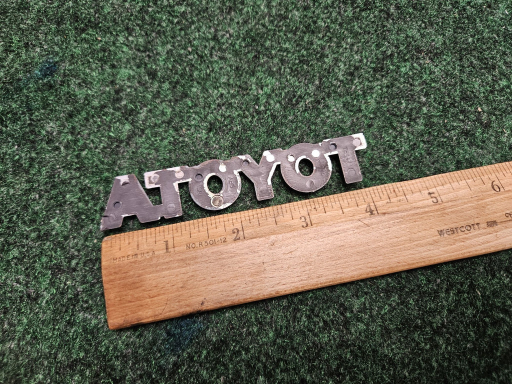 TOYOTA 04-08 Solara 09-11 Matrix Rear Trunk Lid Hatch Emblem OEM 75447-AA040 5M9