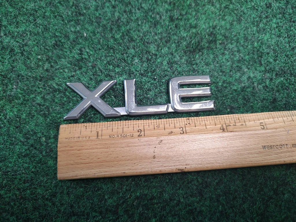 Toyota OEM XLE Chrome Plastic Emblem Badge Logo Nameplate Name 75443-06020 1S3