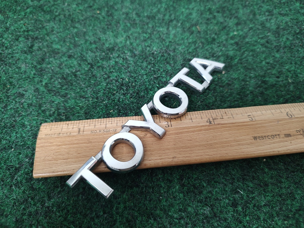 Toyota OEM Chrome Plastic 5" Rear Trunk Emblem Badge Logo Nameplate Name 1M4