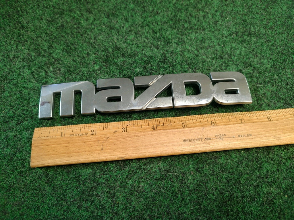 Mazda 2000-2006 MPV Rear Tailgate Emblem Badge Logo Nameplate LC63 51 710 1S7