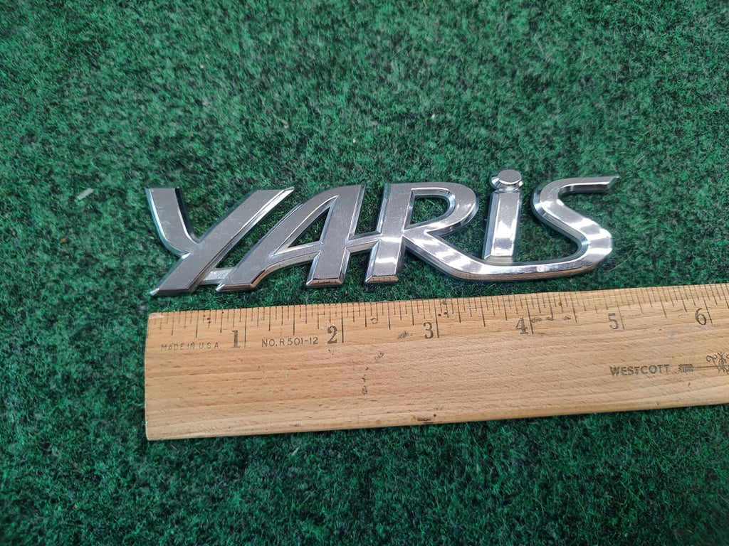 2006-2011 TOYOTA YARIS REAR EMBLEM LOGO BADGE SYMBOL CHROME LETTERS OEM 2S7