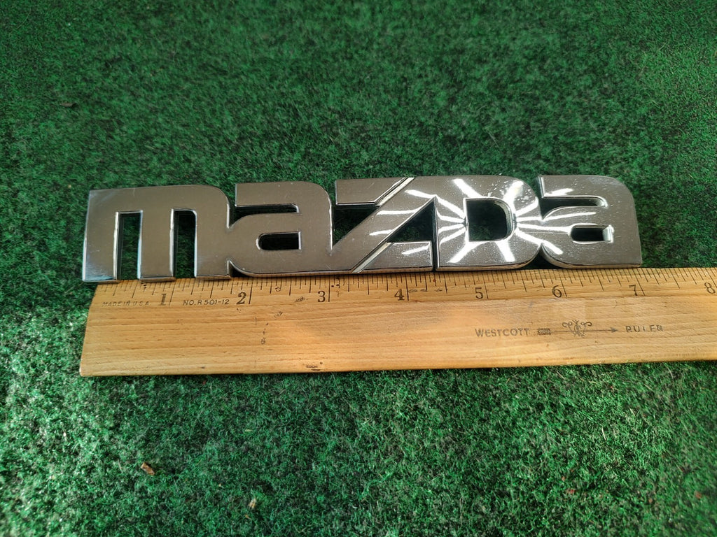 2000-2006 Mazda MPV Rear Emblem Name Plate LC62-51710 2S5