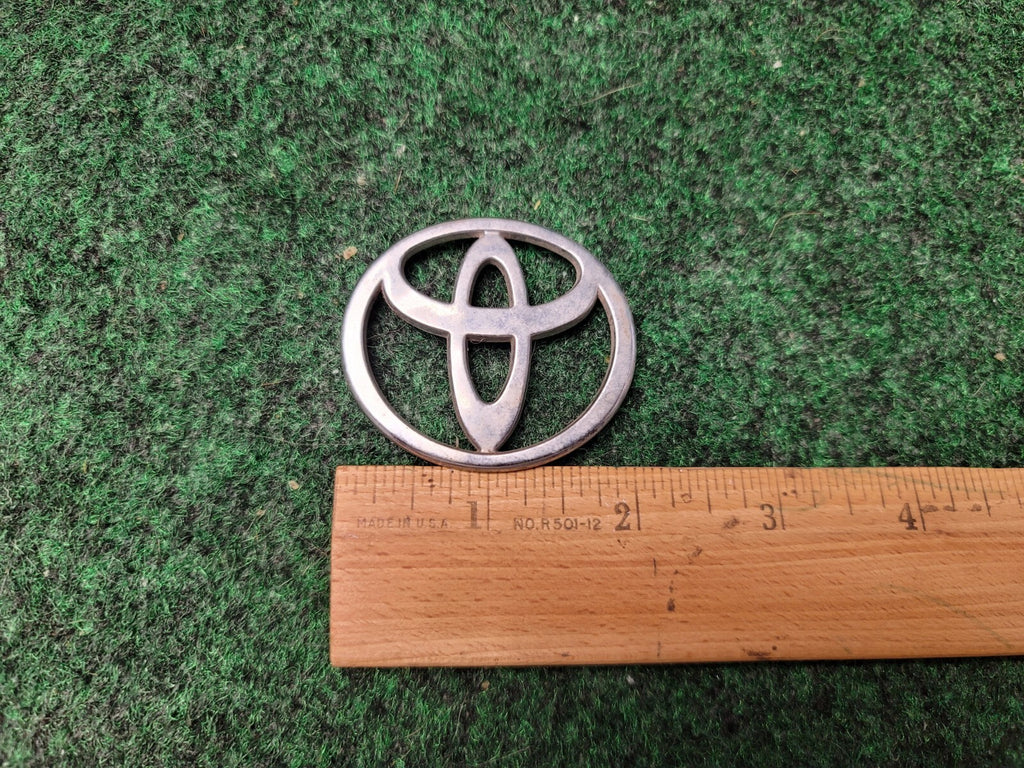 Toyota Chrome Plastic Emblem Badge Logo OEM 2" wide 10L3