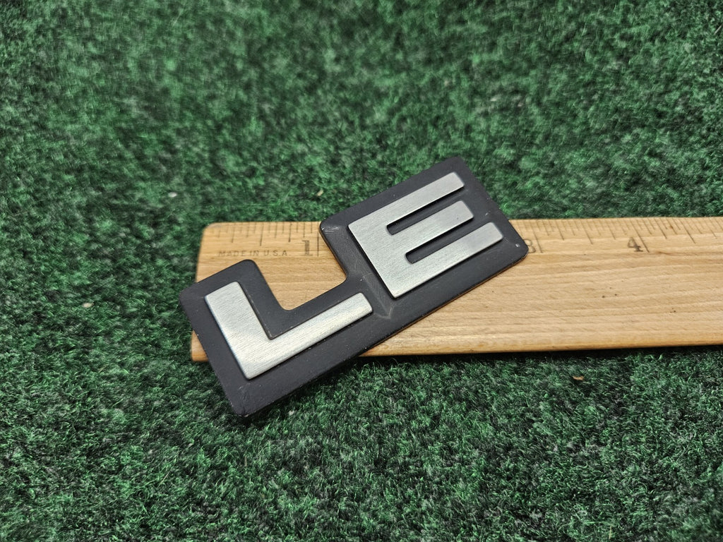 1987-1996 Dodge Dakota LE Cab Corner Emblem Name Plate Badge  55026887 GL3
