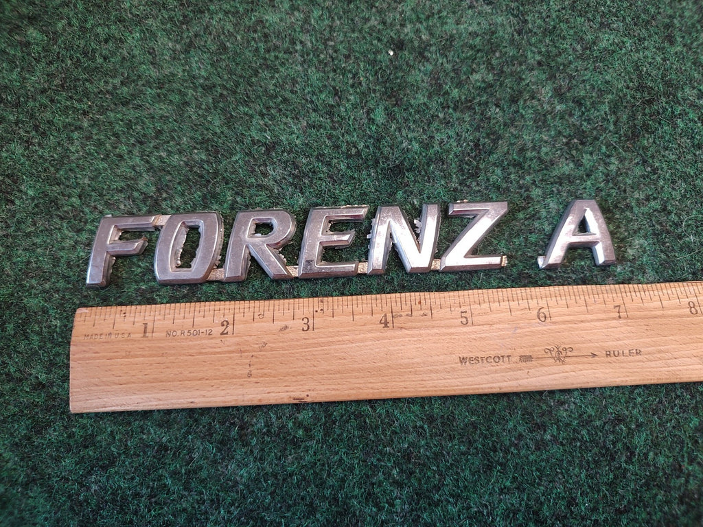 04 05 06 - 08 Suzuki Forenza Emblem Nameplate Rear Trunk Lift Gate Hatch OEM 3S1
