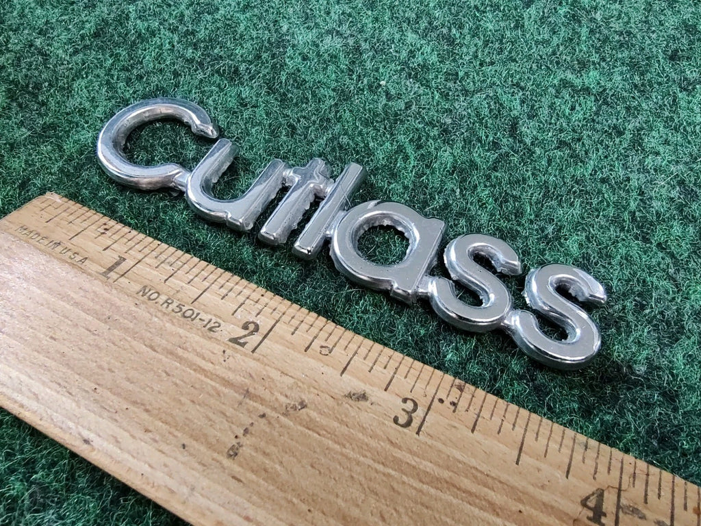Oldsmobile Cutlass Emblem Nameplate Chrome Metal OEM 1S1