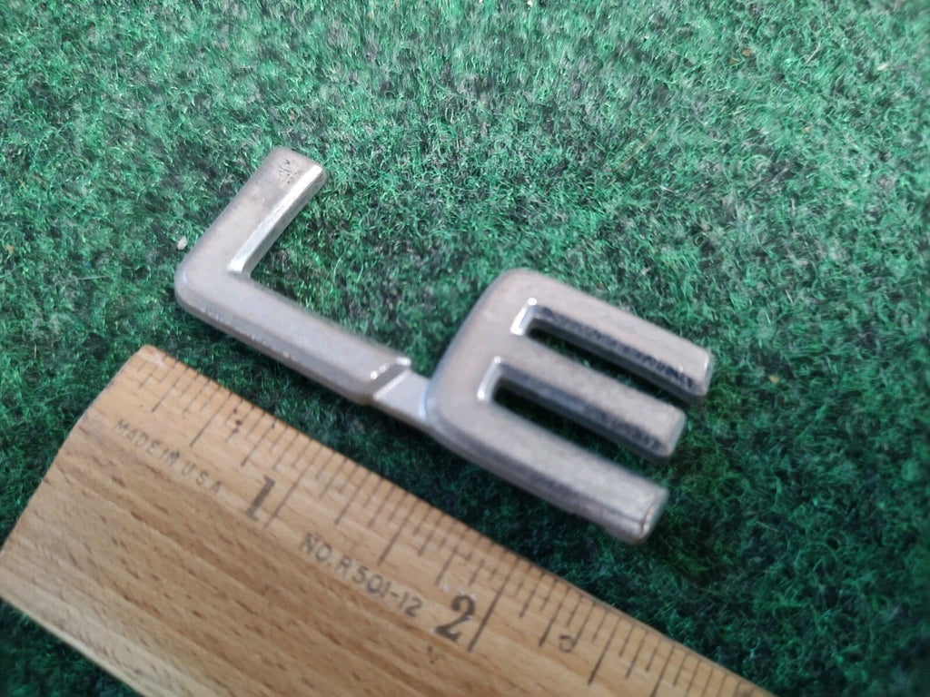 Toyota OEM LE Chrome Emblem Badge Logo Nameplate Name Plate 2S2