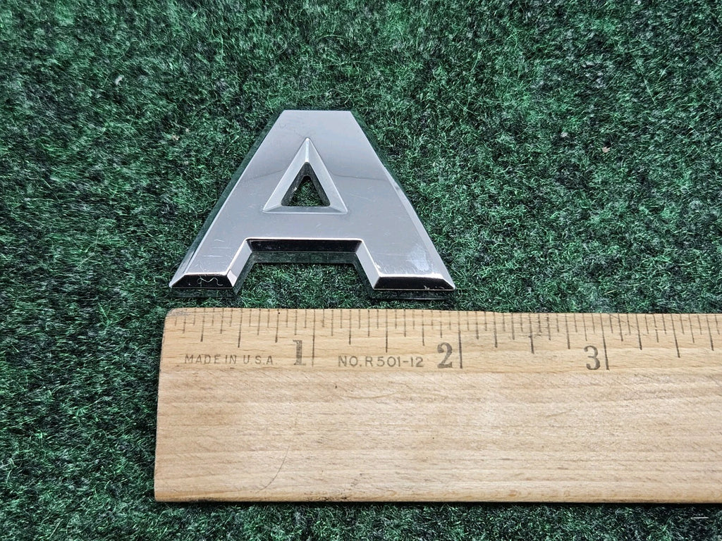 Nissan Armada “A” Emblem Letter Badge Decal Rear Door Hatch OEM 7S8