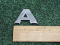 Nissan Armada “A” Emblem Letter Badge Decal Rear Door Hatch OEM 7S8