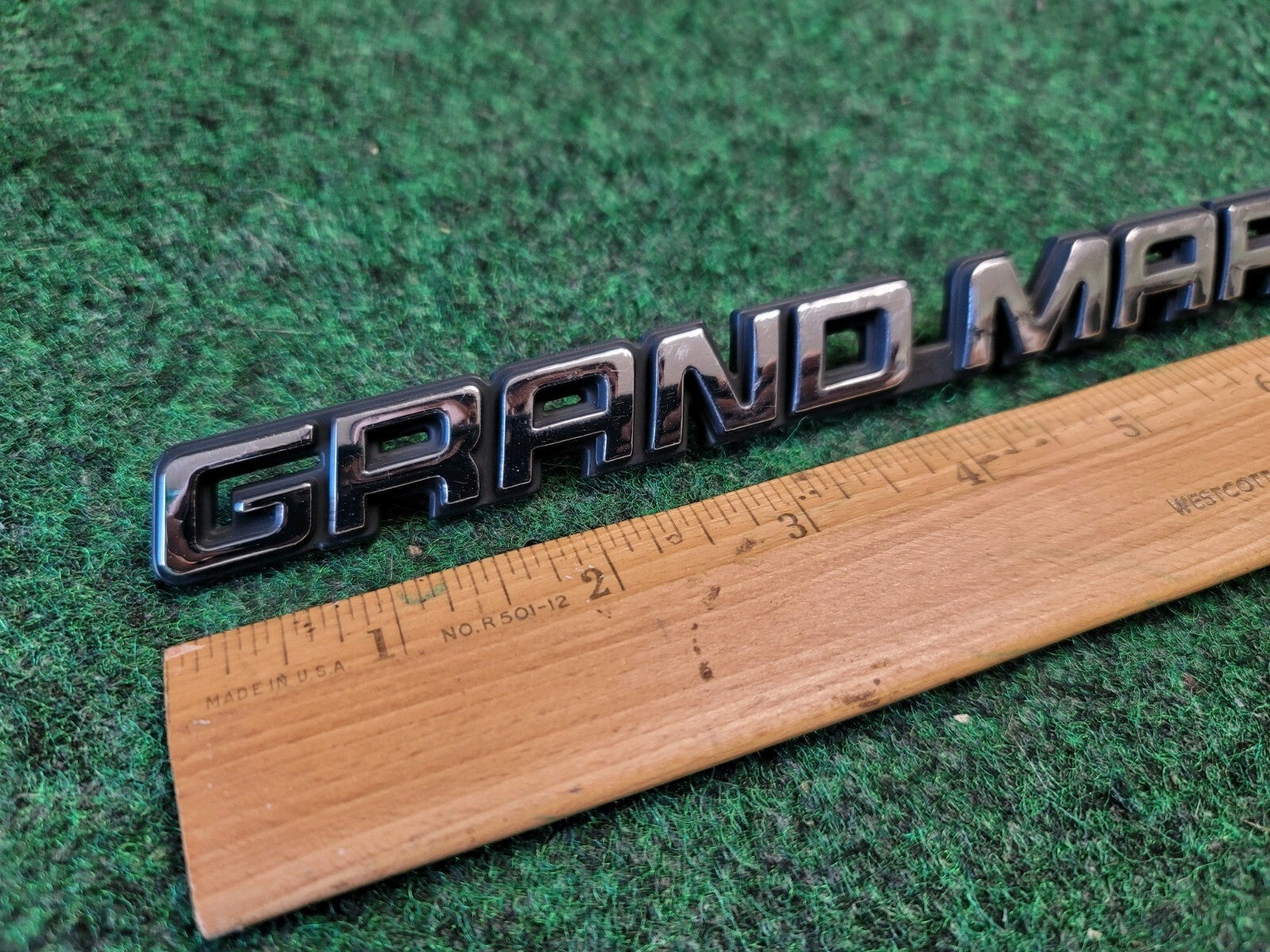 98 99 00 01 02 MERCURY GRAND MARQUIS GS REAR EMBLEM BADGE SYMBOL OEM 1M6