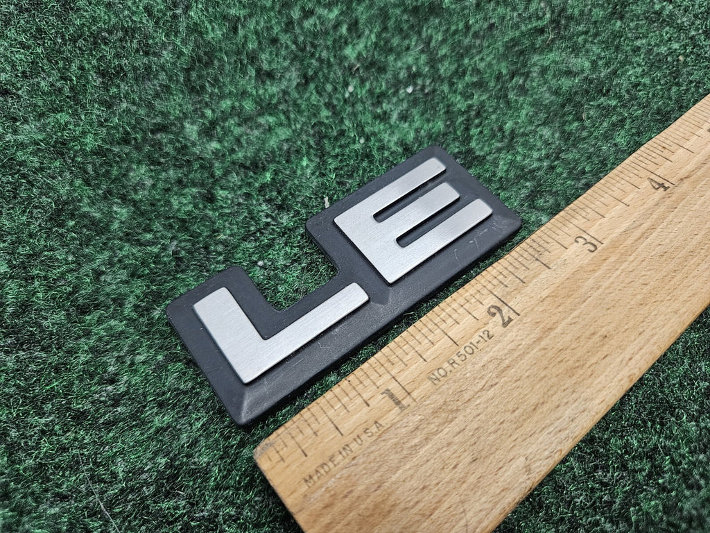 1987-1996 Dodge Dakota LE Cab Corner Emblem Name Plate Badge  55026887 GL2