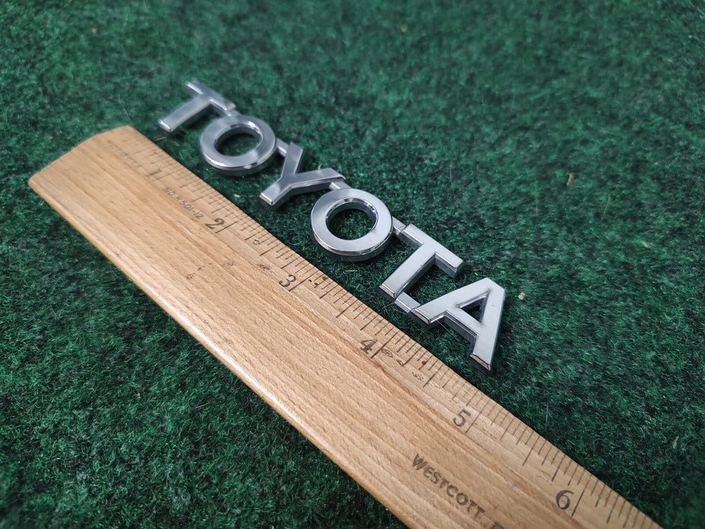 Toyota OEM Chrome Plastic 5" Rear Trunk Emblem Badge Logo Nameplate Name 1M4