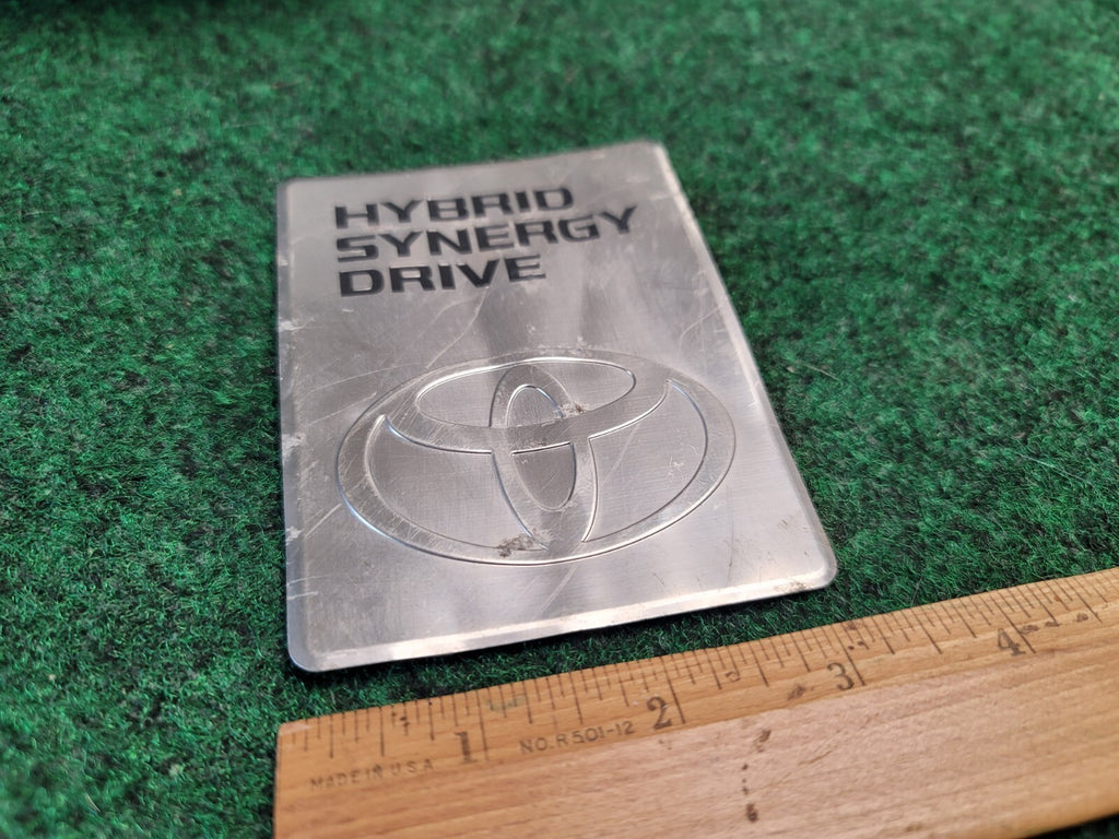 2004-2009 TOYOTA PRIUS HYBRID SYNERGY DRIVE DC CONVERTER EMBLEM BADGE OEM 2M3